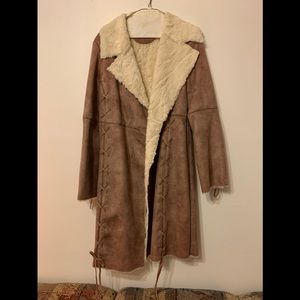 Prague camel color leather coat with inseam straps